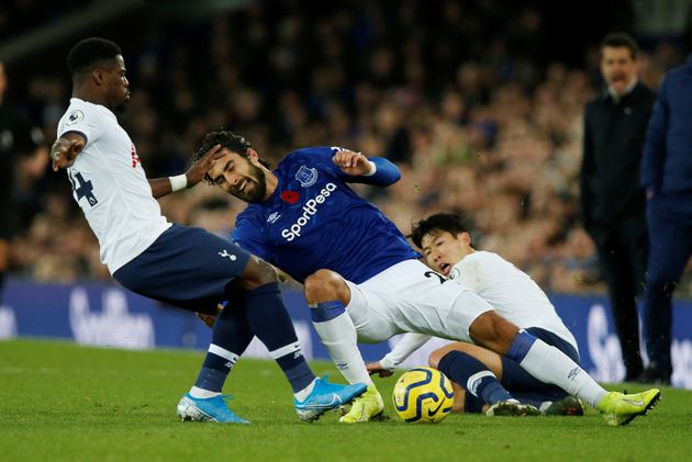 Soccer Football - Premier League - Everton v Tottenham Hotspur - Goodison Park, Liverpool, Britain - November 3, 2019  Everton's Andre Gomes sustains an injury in this action with Tottenham Hotspur's Serge Aurier and Son Heung-min   REUTERS/Andrew Yates  EDITORIAL USE ONLY. No use with unauthorized audio, video, data, fixture lists, club/league logos or 'live' services. Online in-match use limited to 75 images, no video emulation. No use in betting, games or single club/league/player publications.  Please contact your account representative for further details.