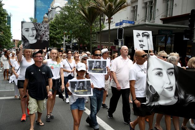AUCKLAND, NEW ZEALAND - DECEMBER 15:  Several hundred people walk up Queen Street in a silent march to remember Grace Millane on December 15, 2018 in Auckland, New Zealand. The body of 22-year-old Grace Millane was found in a section of bush just near Scenic Drive in West Auckland's Waitakere Ranges on Sunday, following an extensive search for the British tourist. She was seen on Saturday December 1 at the CityLIfe hotel in Auckland. A 26 year old man appeared in Auckland District Court last Monday charged with her murder. The judge has granted suppression order prohibiting the publication of the accused's name.  (Photo by Phil Walter/Getty Images)
