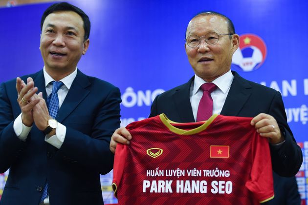 Vietnam's South Korean head coach Park Hang-seo (R) and Vice President of Vietnam Football Federation, Tran Quoc Tuan (L) attend a signing ceremony in Hanoi on November 7, 2019. - Vietnam Football Federation renewed the contract of Park Hang-seo, head coach of the men's national football team. (Photo by Nhac NGUYEN / AFP) (Photo by NHAC NGUYEN/AFP via Getty Images)