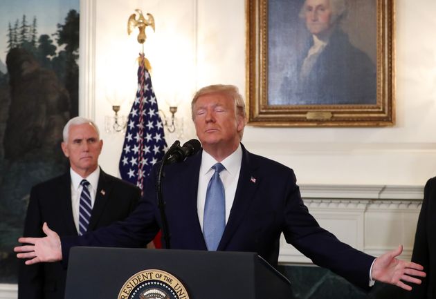 WASHINGTON, DC - OCTOBER 23: U.S. President Donald Trump is flanked by Vice President Mike Pence (L) while making statement in the Diplomatic Room at the White House, on October 23, 2019 in Washington, DC. President Trump announced that the U.S. would be lifting all sanctions imposed on Turkey in response to their invasion of northern Syria. (Photo by Mark Wilson/Getty Images)