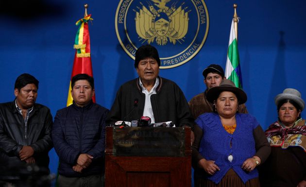 Bolivia's President Evo Morales, center, speaks during a press conference at the military base in El Alto, Bolivia, Sunday, Nov. 10, 2019. Hours later Morales announced his resignation under mounting pressure from the military and the public after his re-election victory triggered weeks of fraud allegations and deadly protests. (AP Photo/Juan Karita)