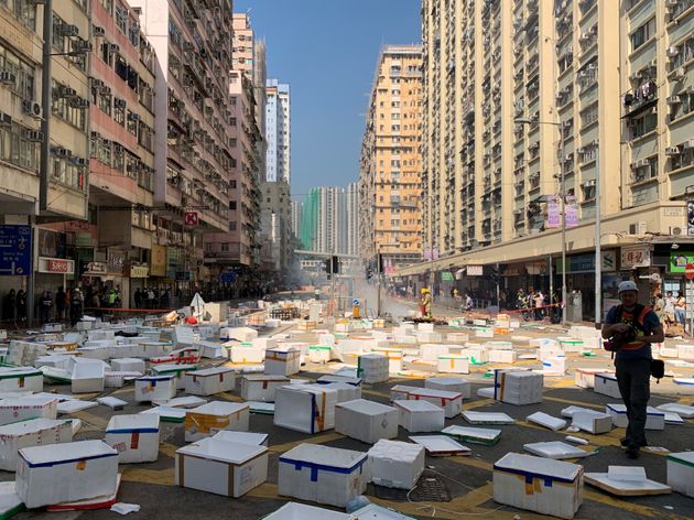 Protesters building barricades from white boxes in Sai Wan Ho area where a boy was allegedly shot and left unconscious this morning in Hong Kong, China November 11, 2019. REUTERS/Jiraporn Kuhakan
