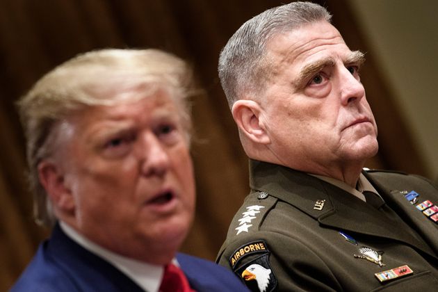 Chairman of the Joint Chiefs of Staff Army General Mark A. Milley (R) listens while US President Donald Trump speaks before a meeting with senior military leaders in the Cabinet Room of the White House in Washington, DC on October 7, 2019. (Photo by Brendan Smialowski / AFP) (Photo by BRENDAN SMIALOWSKI/AFP via Getty Images)