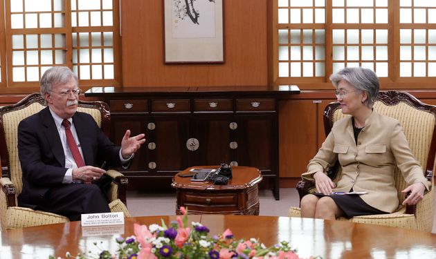 U.S. National Security Advisor John Bolton, left, talks with South Korean Foreign Minister Kang Kyung-wha during a meeting at the foreign ministry in Seoul, South Korea, Wednesday, July 24, 2019. (AP Photo/Ahn Young-joon, Pool)