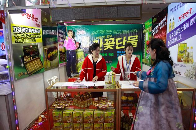 A booth of Pyongyang Taehung Trading Co. is seen during Pyongyang International Agriculture and Foodstuff Exhibition at the Pyongyang Indoor Stadium in Pyongyang, North Korea Monday, Nov. 11, 2019. More than 60 companies from different countries participated in the exhibition. (AP Photo/Jon Chol Jin)