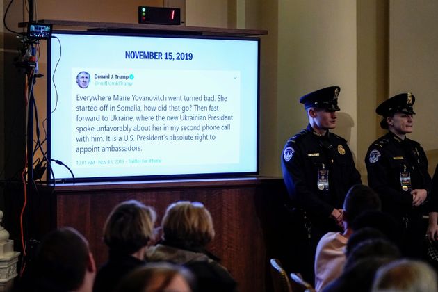 A tweet from US President Donald Trump about US Ambassador to Ukraine, Marie Yovanovitch, is displayed during her testimony before the House Intelligence Committee hearing as part of the impeachment inquiry into US President Donald Trump on Capitol Hill in Washington, DC on November 15, 2019. (Photo by JOSHUA ROBERTS / POOL / AFP) (Photo by JOSHUA ROBERTS/POOL/AFP via Getty Images)