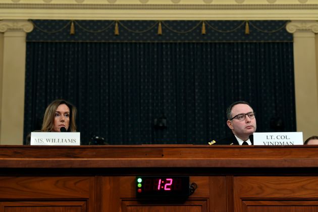 Jennifer Williams, an aide to Vice President Mike Pence, and National Security Council aide Lt. Col. Alexander Vindman, testify before the House Intelligence Committee on Capitol Hill in Washington, Tuesday, Nov. 19, 2019, during a public impeachment hearing of President Donald Trump's efforts to tie U.S. aid for Ukraine to investigations of his political opponents. (AP Photo/Susan Walsh)