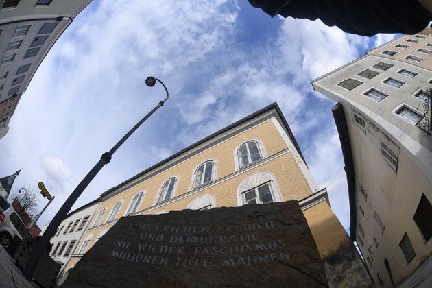 12 March 2018, Germany, Braunau: A memorial stone against war and fascism in front of Adolf Hitler's birth house. Clouds and sun appear above the border town, the weather alternates between light rain and sunshine. Photo: Felix Hörhager/dpa (Photo by Felix Hörhager/picture alliance via Getty Images)