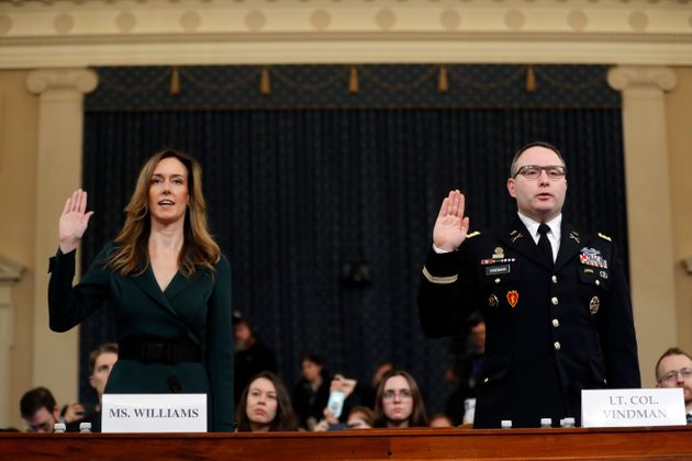 Jennifer Williams, an aide to Vice President Mike Pence, left, and National Security Council aide Lt. Col. Alexander Vindman, are sworn in to testify before the House Intelligence Committee on Capitol Hill in Washington, Tuesday, Nov. 19, 2019, during a public impeachment hearing of President Donald Trump's efforts to tie U.S. aid for Ukraine to investigations of his political opponents. (AP Photo/Andrew Harnik)