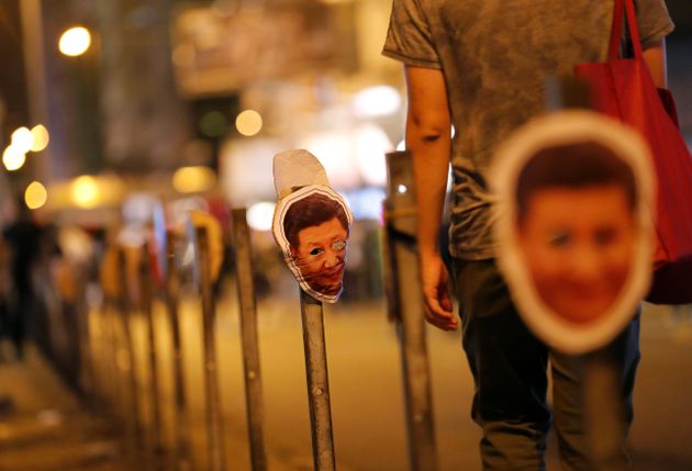 Masks depicting China's President Xi Jinping hang on guard rail on a street during anti-government protest on Halloween day in Hong Kong, China October 31, 2019. REUTERS/Kim Kyung-Hoon