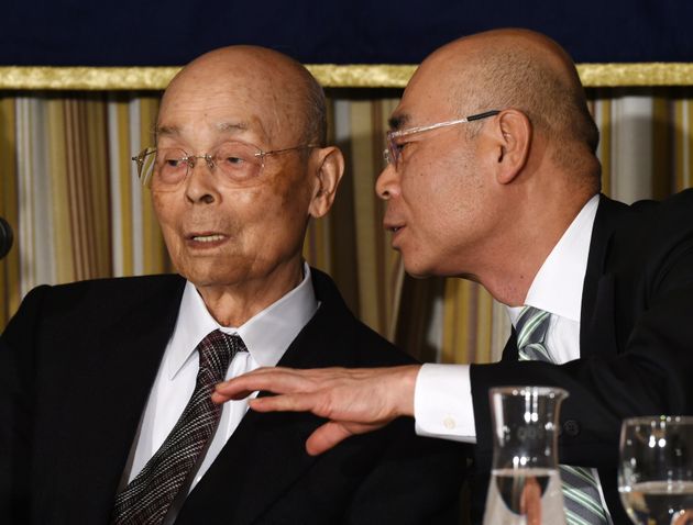 Top Japanese sushi chef Jiro Ono (L) listens to his son, Yoshikazu Ono (R), while attending a press conference at the Foreign Correspondents' Club (FCC) in Tokyo on November 4, 2014.  The 84-year-old senior Ono, who has reputedly wowed US President Barack Obama to call him the best in the world, warns of a sea change in materials for the food due to overfishing, especially of tuna.     AFP PHOTO / TOSHIFUMI KITAMURA        (Photo credit should read TOSHIFUMI KITAMURA/AFP via Getty Images)