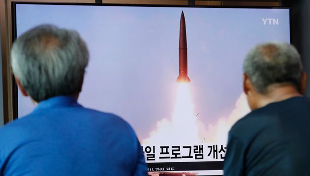 People watch a TV showing a file image of North Korea's missile launch during a news program at the Seoul Railway Station in Seoul, South Korea, Tuesday, Aug. 6, 2019. North Korea on Tuesday continued to ramp up its weapons demonstrations by firing unidentified projectiles twice into the sea while lashing out at the United States and South Korea for continuing their joint military exercises that the North says could derail fragile nuclear diplomacy. (AP Photo/Ahn Young-joon)