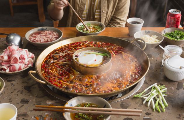 A person is eating hotpot scene