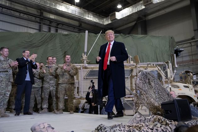 President Donald Trump walks on stage as he arrives to speak to members of the military during a surprise Thanksgiving Day, Thursday, Nov. 28, 2019, at Bagram Air Field, Afghanistan. (AP Photo/Alex Brandon)