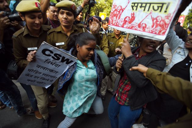 NEW DELHI, INDIA - DECEMBER 2: Members of All India Democratic Youth Organisation (AIDYO), All India Democratic Students Organisation (AIDSO) and others clash with defence personnel during a protest against the horrific rape and murder in Hyderabad, at Parliament Street, on December 2, 2019 in New Delhi, India. The burnt body of the veterinary doctor was found at Shadnagar outskirts in Telangana's Ranga Reddy district Last week. As per the preliminary probe, the doctor was sexually assaulted before being charred to death. The police on Friday arrested four accused persons in the rape and murder case.(Photo by Amal KS/Hindustan Times via Getty Images)