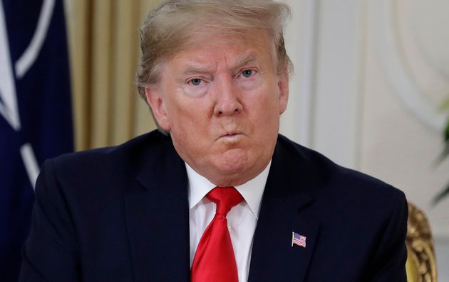 U.S. President Donald Trump grimaces during a meeting with NATO Secretary General, Jens Stoltenberg at Winfield House in London, Tuesday, Dec. 3, 2019. US President Donald Trump will join other NATO heads of state at Buckingham Palace in London on Tuesday to mark the NATO Alliance's 70th birthday. (AP Photo/Evan Vucci)