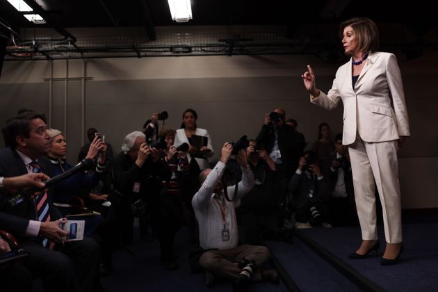 WASHINGTON, DC - DECEMBER 05:  U.S. Speaker of the House Rep. Nancy Pelosi (D-CA) reacts to a reporter’s (L) question about whether she hates President Donald Trump during her weekly news conference December 5, 2019 on Capitol Hill in Washington, DC. Speaker Pelosi discussed the impeachment inquiry against President Donald Trump.  (Photo by Alex Wong/Getty Images)