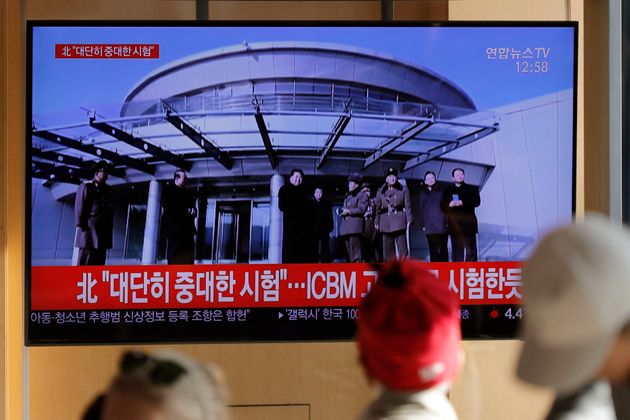 People watch a TV news program reporting North Korea's announcement with a file footage of North Korean leader Kim Jong Un, at the Seoul Railway Station in Seoul, South Korea, Sunday, Dec. 8, 2019. North Korea said Sunday it carried out a “very important test” at its long-range rocket launch site that U.S. and South Korean officials said the North had partially dismantled as part of denuclearization steps. The letters read 'North. Very important test.' (AP Photo/Lee Jin-man)
