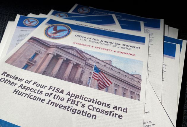The U.S. Justice Department's Inspector General Michael Horowitz's report entitled 'Review of Four FISA Applications and Other Aspects of the FBI's Crossfire Hurricane Investigation' about the origins of the FBI's investigation into contacts between Donald Trump's 2016 presidential campaign and Russia is seen after its release by the Justice Department in Washington, U.S. December 9, 2019.  REUTERS/Jim Bourg