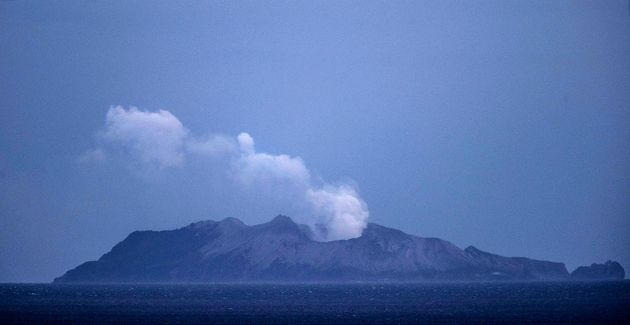 WHAKATANE, NEW ZEALAND - DECEMBER 10: Smoke and ash rises from a volcano on White Island early in the morning on December 10, 2019 in Whakatane, New Zealand. Five people are confirmed dead and several people are missing following a volcanic eruption at White Island on Monday. (Photo by John Boren/Getty Images)
