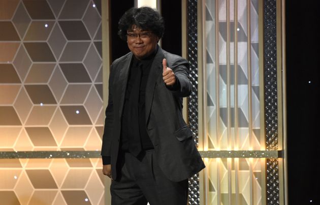 Joon Ho gestures as he appears on stage to accept the Hollywood filmmaker award for 'Parasite'at the 23rd annual Hollywood Film Awards on Sunday, Nov. 3, 2019, at the Beverly Hilton Hotel in Beverly Hills, Calif. (Photo by Chris Pizzello/Invision/AP)