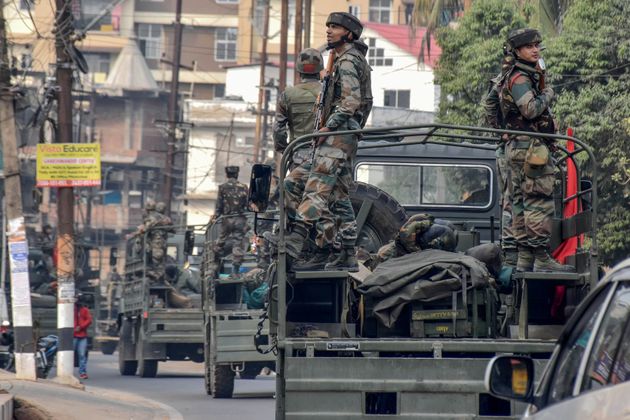 Indian soldiers patrol in their vehicles during a curfew in Guwahati on December 12, 2019, following protests over the government's Citizenship Amendment Bill (CAB). - Authorities deployed thousands of paramilitaries and blocked mobile internet in northeast India on December 12, while police fired blank rounds at protesters who defied a curfew to demonstrate against contentious new citizenship legislation. (Photo by Biju BORO / AFP) (Photo by BIJU BORO/AFP via Getty Images)