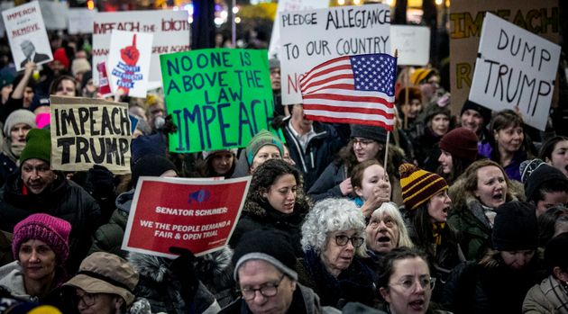An anti-President Trump crowd gather at a rally to protest and call for his impeachment, Tuesday Dec. 17, 2019, in New York. (AP Photo/Bebeto Matthews)