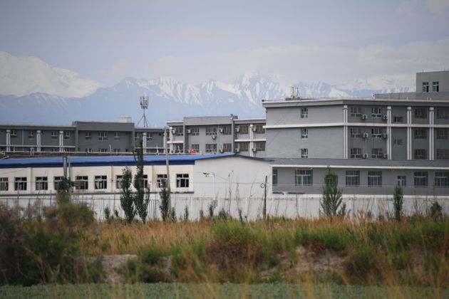 This photo taken on June 4, 2019 shows a facility believed to be a re-education camp where mostly Muslim ethnic minorities are detained, north of Akto in China's northwestern Xinjiang region. - As many as one million ethnic Uighurs and other mostly Muslim minorities are believed to be held in a network of internment camps in Xinjiang, but China has not given any figures and describes the facilities as 'vocational education centres' aimed at steering people away from extremism. (Photo by GREG BAKER / AFP) / TO GO WITH AFP STORY CHINA-XINJIANG-MEDIA-RIGHTS-PRESS,FOCUS BY EVA XIAO        (Photo credit should read GREG BAKER/AFP via Getty Images)