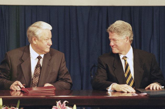 U.S. President Bill Clinton, right, and Russian President Boris Yeltsin, left, look at each other after the signing ceremony for the Non-Proliferation Treaty in the Budapest Convention Center, Dec. 5, 1994, the first day of the two-day CSCE summit meeting in Hungary. The session was marred by disagreements between Clinton and Yeltsin over the future mission and membership of NATO, and by scathing words of Bosnian President Alija Izetbegovic, who accused NATO countries of failing to heed the pleas of Bosnia’s Muslim-led government for help. (AP Photo/David Brauchli)
