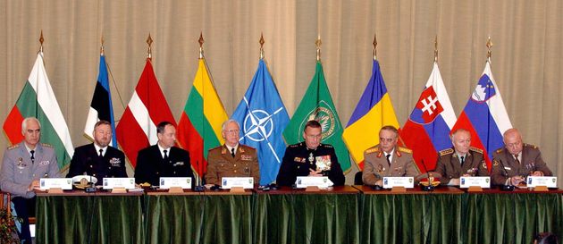 CASTEAU, BELGIUM:  The chiefs of staff of the new member countries sit besides Saceur (Supreme Allied Commander Europe) of NATO, US Marine General James L. Jones (4thR) 15 April 2004, at the SHAPE (Supreme Headquarters of the Allied Powers in Europe) in Casteau, Belgium, during a ceremony marking the accession to SHAPE of seven new member nations. Bulgaria, Estonia, Latvia, Lithuania, Romania, Slovakia and Slovenia entered NATO last 02 April.   AFP PHOTO   BELGA/YVES BOUCAU  (Photo credit should read YVES BOUCAU/AFP via Getty Images)