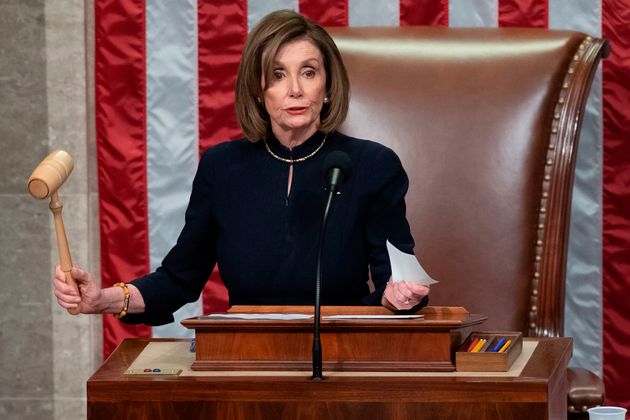 US Speaker of the House Nancy Pelosi presides over Resolution 755, Articles of Impeachment Against President Donald J. Trump as the House votes at the US Capitol in Washington, DC, on December 18, 2019. - The US House of Representatives voted 229-198 on Wednesday to impeach President Donald Trump for obstruction of Congress. The House impeached Trump for abuse of power by a 230-197 vote. The 45th US president is just the third occupant of the White House in US history to be impeached. (Photo by SAUL LOEB / AFP) (Photo by SAUL LOEB/AFP via Getty Images)