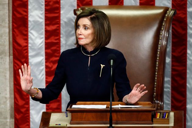 House Speaker Nancy Pelosi of Calif., gestures for Democrats to stop taking during a vote on the articles of impeachment against President Donald Trump, Wednesday, Dec. 18, 2019, on Capitol Hill in Washington. (AP Photo/Patrick Semansky)