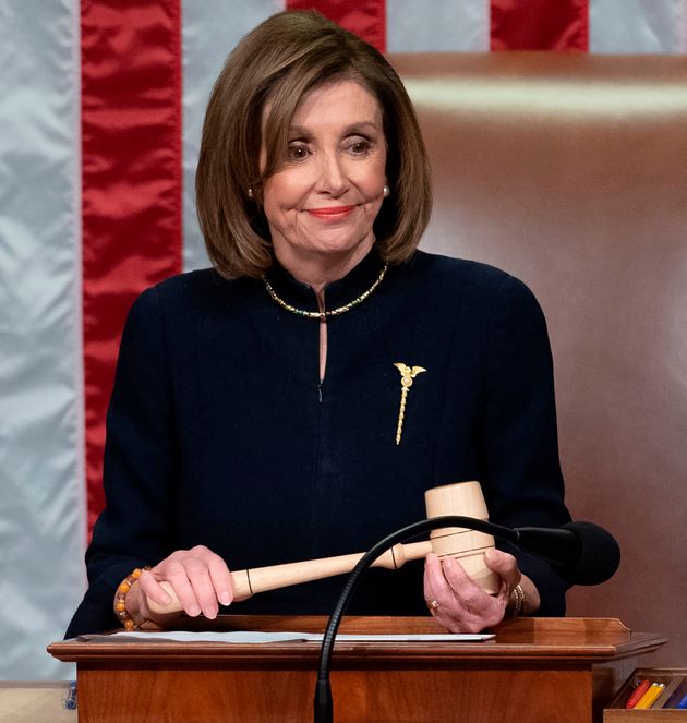 US Speaker of the House Nancy Pelosi presides over Resolution 755, Articles of Impeachment Against President Donald J. Trump as the House votes at the US Capitol in Washington, DC, on December 18, 2019. - The US House of Representatives voted 229-198 on Wednesday to impeach President Donald Trump for obstruction of Congress. The House impeached Trump for abuse of power by a 230-197 vote. The 45th US president is just the third occupant of the White House in US history to be impeached. (Photo by SAUL LOEB / AFP) (Photo by SAUL LOEB/AFP via Getty Images)