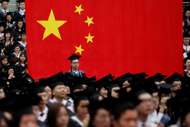 Students attend a graduation ceremony at Fudan University in Shanghai, China June 23, 2017. REUTERS/Aly Song