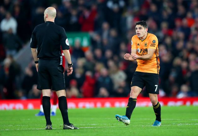 Wolverhampton Wanderers' Pedro Neto (right) appeals to Referee Anthony Taylor as VAR disallows his goal during the Premier League match at Anfield Stadium, Liverpool. (Photo by Nick Potts/PA Images via Getty Images)