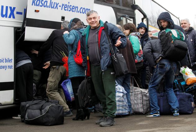 Prisoners of war get off a bus after they were released by Ukrainian authorities and exchanged during a captives' swap between Ukraine and the separatist republics near the Mayorsk crossing point in Donetsk region, Ukraine December 29, 2019. REUTERS/Alexander Ermochenko