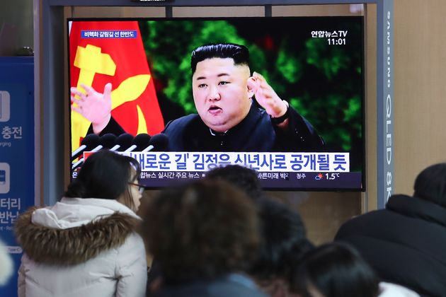 People watch a TV screen showing an image of North Korean leader Kim Jong Un during a news program at the Seoul Railway Station in Seoul, South Korea, Sunday, Dec. 29, 2019. North Korea opened a high-profile political conference to discuss how to overcome 'harsh trials and difficulties,' state media reported Sunday, days before a year-end deadline set by Pyongyang for Washington to make concessions in nuclear negotiations. The sign reads: 'Kim Jong Un will reveal a new way in new year's speech.' (AP Photo/Ahn Young-joon)