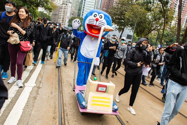 HONG KONG, CHINA - 2020/01/01: Doraemon joins the march.
Entering the 7th month of civil unrest, protesters marched the streets, calling for the five demands to be met. Demonstrators chanted slogans and sang songs. Police in riot gear appeared and arrested several masked protesters. (Photo by Willie Siau/SOPA Images/LightRocket via Getty Images)