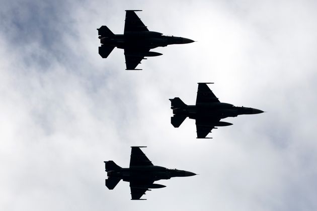 ASAKA, JAPAN - OCTOBER 14: Japan Air Self-Defense Force F2 fighter jets fly during the annual review of the country's Self-Defense Forces at the Japan Ground Self Defense Force Camp Asaka on October 14, 2018 in Asaka, Japan. Japanese Prime Minister Shinzo Abe has reportedly been pushing through constitutional revision after winning his party's leadership and seeking to give explicit legal standing to the Self-Defense Forces this year. (Photo by Tomohiro Ohsumi/Getty Images)