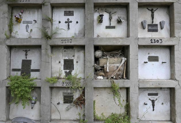 Human remains are seen at a demaged niche of the Chacarita Cemetery in Buenos Aires, Argentina, on November 26, 2019. - No-one can escape Argentina's biggest economic crisis in almost two decades: not even the dead. Such are the costs of buying, renting and maintaining graves and niches that many people are opting to cremate their loved ones. (Photo by JUAN MABROMATA / AFP) (Photo by JUAN MABROMATA/AFP via Getty Images)