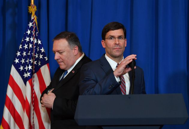 US Secretary of State Mike Pompeo (L) leaves the stage to US Secretary of Defense Mark Esper (R) during a briefing on the past 72 hours events in Mar a Lago, Palm Beach, Florida on December 29, 2019. - Pompeo says they came to brief POTUS on events of past 72 hours
Pompeo: We will not stand for the Islamic Republic of Iran to take actions that put American men and women in jeopardy. (Photo by Nicholas Kamm / AFP) (Photo by NICHOLAS KAMM/AFP via Getty Images)