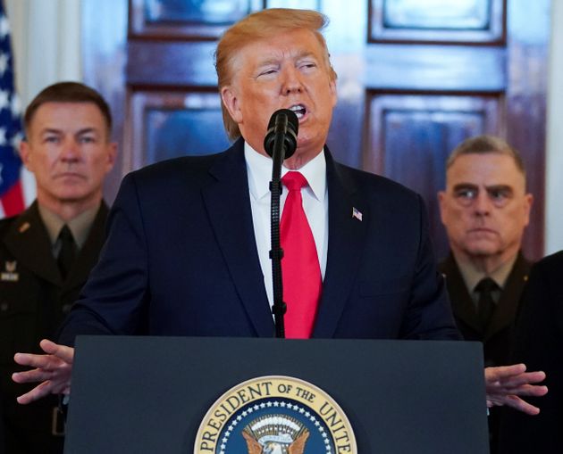 U.S. President Donald Trump delivers a statement about Iran as U.S. Army Chief of Staff General James McConville and Chairman of the Joint Chiefs of Staff Army General Mark Milley listen in the Grand Foyer at the White House in Washington, U.S., January 8, 2020. REUTERS/Kevin Lamarque