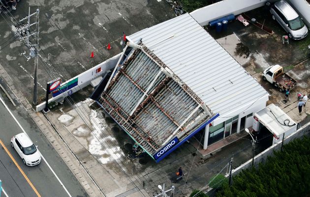 The rooftop of a gas station is collapsed after typhoon hit the area in Tateyama, south of Tokyo, Monday, Sept. 9, 2019. A powerful typhoon has passed over Tokyo, halting major train lines affecting morning rush-hour commuters and knocking over scaffolding and causing other damage but no reported deaths. (Kyodo News via AP)