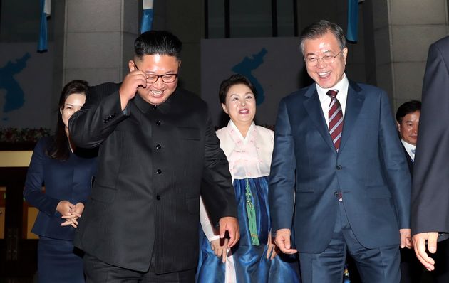 South Korean President Moon Jae-in, right, his wife Kim Jung-sook, second from right, North Korean leader Kim Jong Un and his wife Ri Sol Ju, left, leave Pyongyang Grand Theatre in Pyongyang, North Korea, Tuesday, Sept. 18, 2018. (Pyongyang Press Corps Pool via AP)