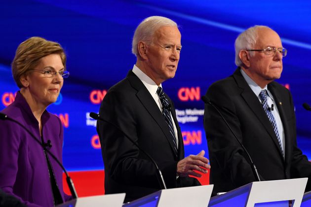 Democratic presidential hopefuls Massachusetts Senator Elizabeth Warren (L), former Vice President Joe Biden (C) and Vermont Senator Bernie Sanders participate of the seventh Democratic primary debate of the 2020 presidential campaign season co-hosted by CNN and the Des Moines Register at the Drake University campus in Des Moines, Iowa on January 14, 2020. (Photo by Robyn Beck / AFP) (Photo by ROBYN BECK/AFP via Getty Images)