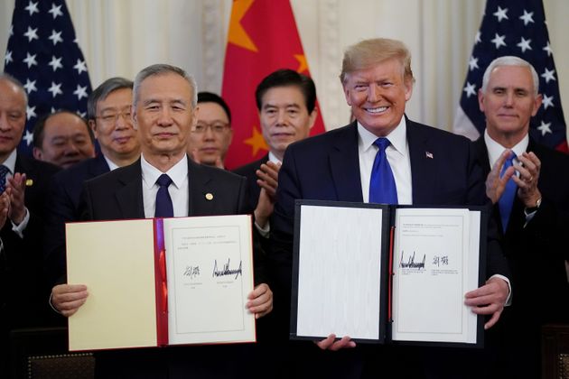 U.S. President Donald Trump stands Chinese Vice Premier Liu He after signing 'phase one' of the U.S.-China trade agreement in the East Room of the White House in Washington, U.S., January 15, 2020. REUTERS/Kevin Lamarque?