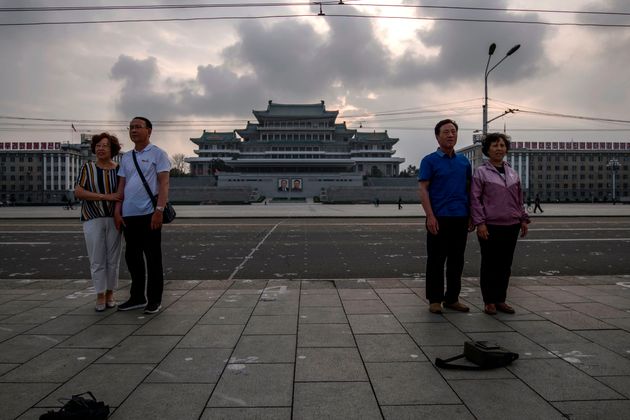 Tourists from China pose for photos on Kim Il Sung square in Pyongyang on June 19, 2019. (Photo by Ed JONES / AFP)        (Photo credit should read ED JONES/AFP via Getty Images)