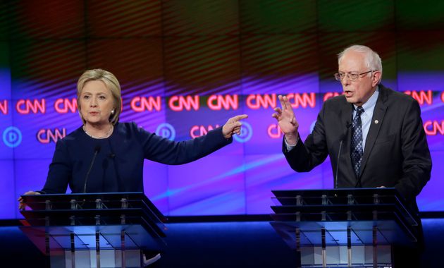 FILE - In this March 6, 2016 file photo, Democratic presidential candidates Hillary Clinton, left, and, Sen. Bernie Sanders, I-Vt., argue a point during a Democratic presidential primary debate at the University of Michigan-Flint in Flint, Mich. Clinton is facing the most important debates of her life as she squares off against Donald Trump beginning Monday, Sept. 26, 2016 _ three high-stakes contests that could set the momentum for the remainder of the presidential campaign. (AP Photo/Carlos Osorio, File)