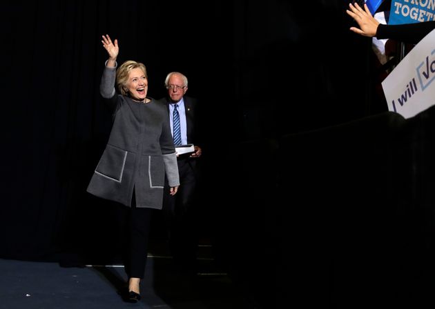 Democratic presidential candidate Hillary Clinton and Sen. Bernie Sanders, I-Vt. arrive for a panel discussion at the University Of New Hampshire in Durham, N.H., Wednesday, Sept. 28, 2016. (AP Photo/Matt Rourke)