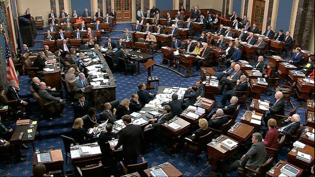 In this image from video, Senators vote on approving the rules for the impeachment trial against President Donald Trump in the Senate at the U.S. Capitol in Washington, Wednesday, Jan. 22, 2020. Senate resolution 483 passed along a party-line vote of 53-47. (Senate Television via AP)